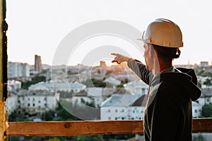 Hard hat builder inside building under construction