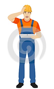 Builder holding digital tablet and grabbed his head