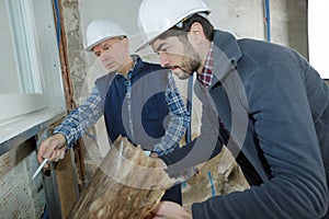 Builder and inspector looking at new property