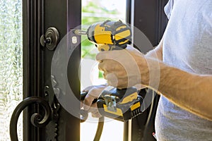 Builder in installing a door lock the door of a new house