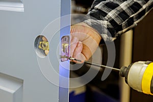 Builder is installing lock a doot in the room