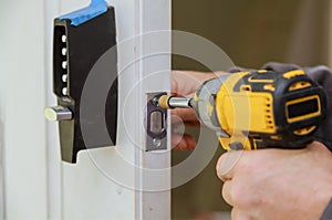Builder is installing lock a doot in the room