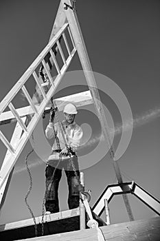 Builder with ladder and winch