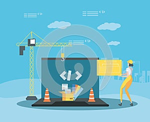 builder and laptop with webpage under cosntruction photo