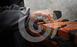 Builder laying bricks