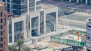 Builder on a Lift Platform on a construction site timelapse. Man at work