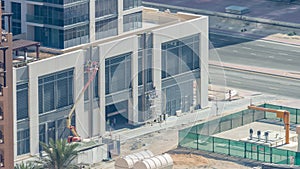 Builder on a Lift Platform on a construction site timelapse. Man at work