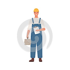 Builder man or engineer standing with toolkit in professional uniform, helmet and dungarees. Repair service, laborer or
