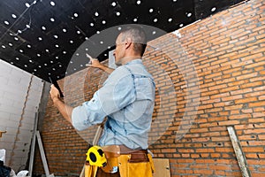 Builder man using media interface. Mixed media.