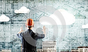 Builder man using media interface . Mixed media