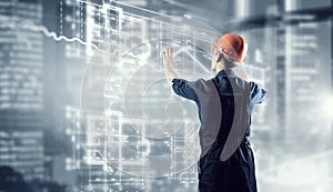 Builder man using media interface . Mixed media