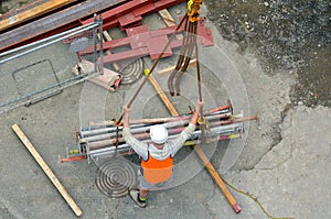 Builder manages the construction process of crane hook lifting w