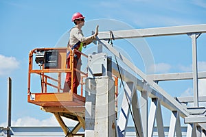 Builder millwright worker at construction site photo
