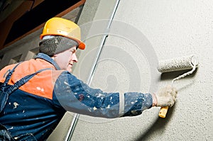 Builder plastering facade wall photo