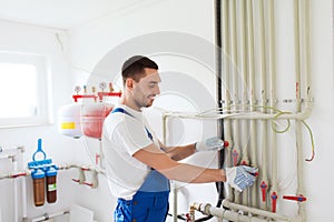 Builder or plumber working indoors