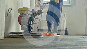 Mechanized grout screed concrete floor close-up photo