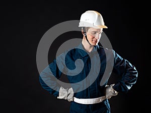 A builder or repairman, a man in a robe and a protective helmet