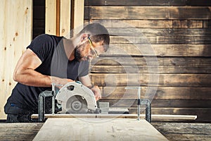 Builder saws a board