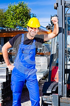 Builder with site pallet transporter or lift fork truck
