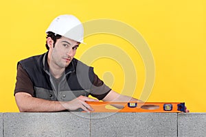 Builder with a spirit level