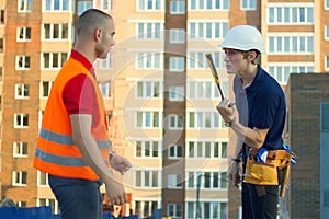 Builder in stress and constructor foreman worker with helmet and vest