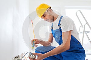 Builder with tablet pc and equipment indoors