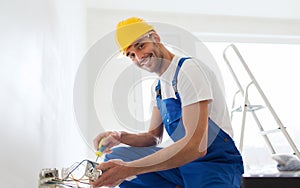 Builder with tablet pc and equipment indoors