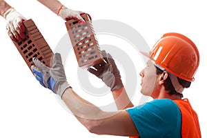 Builder taking the bricks