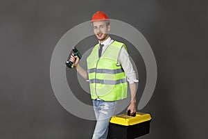 Builder with tool box and screwdriver