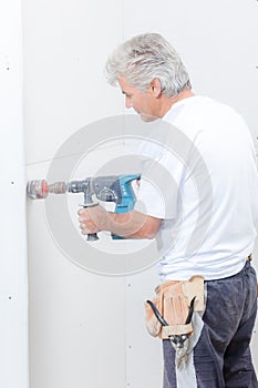 Builder using drill with attachment