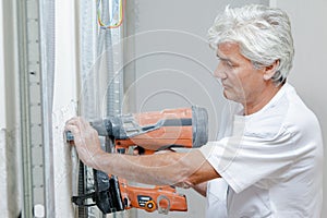 Builder using nail gun