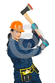 Builder woman working with ax