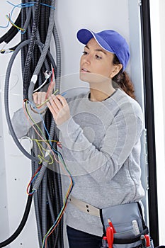 builder woman working with cables