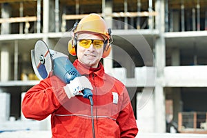 Builder worker at construction site photo