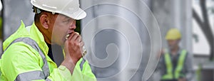 Builder worker eats at construction site