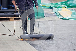 Builder worker at floor slab insulation work