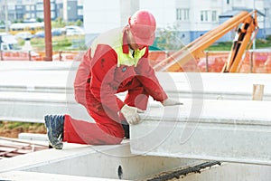 Builder worker installing concrete slab