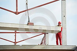 Builder worker installing concrete slab