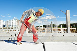 Builder worker installing concrete slab