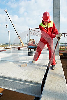 Builder worker installing concrete slab