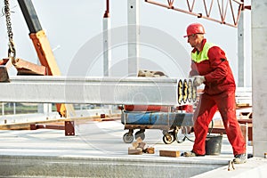 Builder worker installing concrete slab