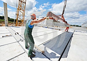 Builder worker installing concrete slab