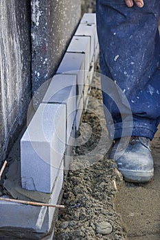 Builder worker installing insulation layer 2