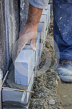 Builder worker installing insulation layer 3