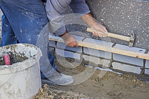 Builder worker installing insulation layer 4