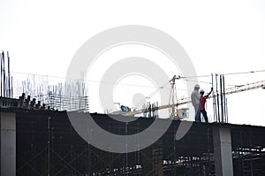 Builder worker with Machinery Building Construction Site