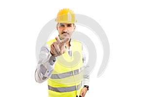 Builder or worker making I`m watching you gesture