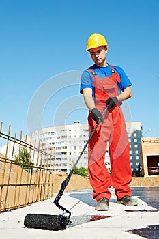 Builder worker at roof insulation work