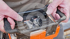 Builder worker working on remote control crane panel, moving building materials