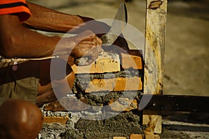 Worker adjusting the split bricks